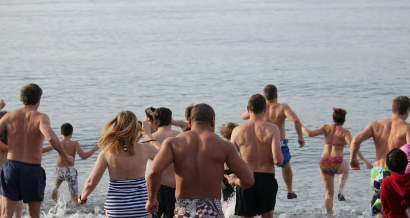 group running into water