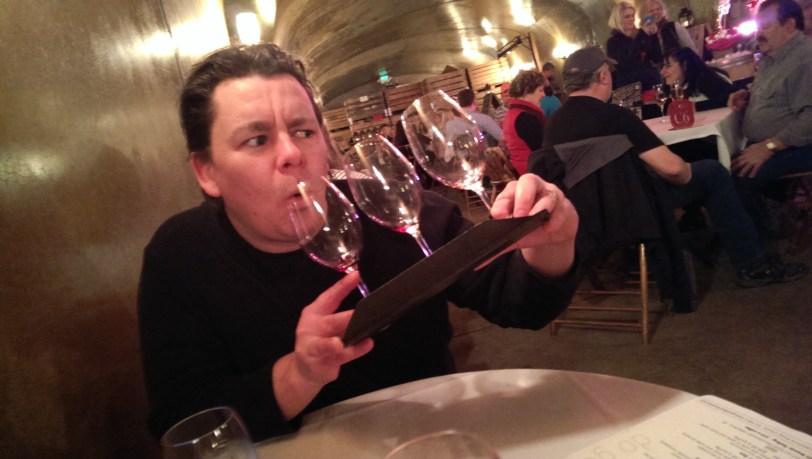 Chad attempting to drink a flight of wine at Karma