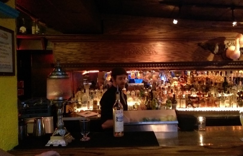 The Can-Can bartender providing a history of absinthe.